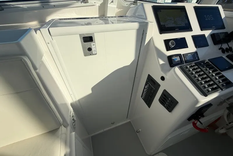 Slide: The Image of 2023 Steiger Craft 31 Chesapeake helm with modern navigation and control panels. - 30