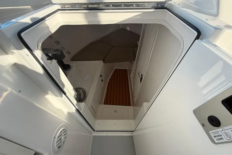 Slide: The Image of Interior cabin view of 2023 Steiger Craft 31 Chesapeake boat, featuring sleek design and wood flooring. - 31