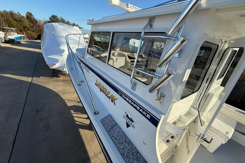 Slide: The Image of 2023 Steiger Craft 31 Chesapeake boat docked, showcasing sleek design and modern features. - 37