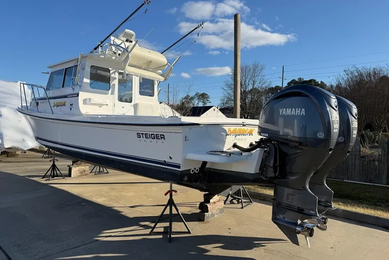Slide: The Image of 2023 Steiger Craft 31 Chesapeake boat with dual Yamaha engines on display. - 8