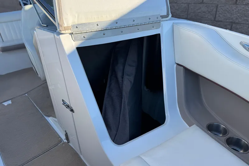 Slide: The Image of Open storage compartment in a 2006 Cobalt 220 boat interior. - 17