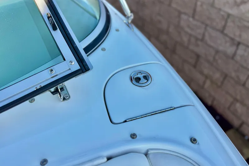Slide: The Image of Close-up of a 2006 Cobalt 220 boat's windshield and deck details. - 18