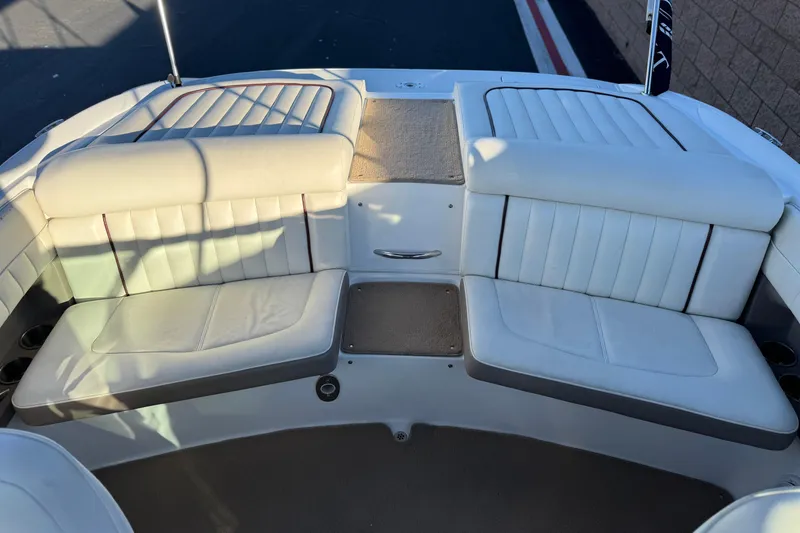 Slide: The Image of Interior seating of a 2006 Cobalt 220 boat with white upholstery. - 20