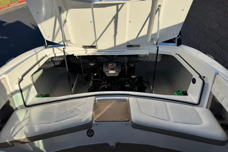 Slide: The Image of Open engine compartment of a 2006 Cobalt 220 boat, showcasing interior details. - 21