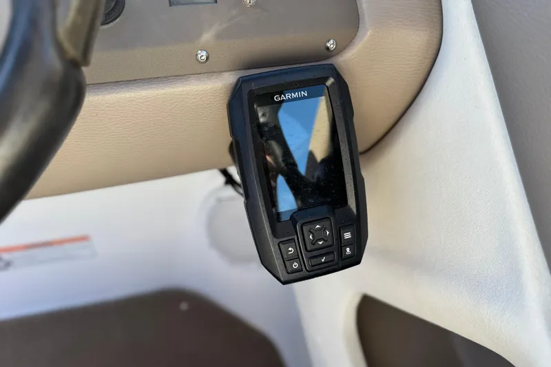 Slide: The Image of Garmin device mounted on 2006 Cobalt 220 boat dashboard. - 30