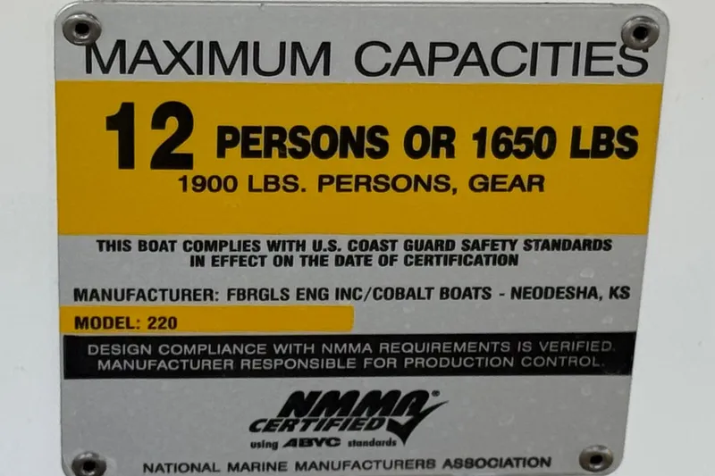 Slide: The Image of 2006 Cobalt 220 capacity plate: 12 persons or 1650 lbs, NMMA certified. - 33