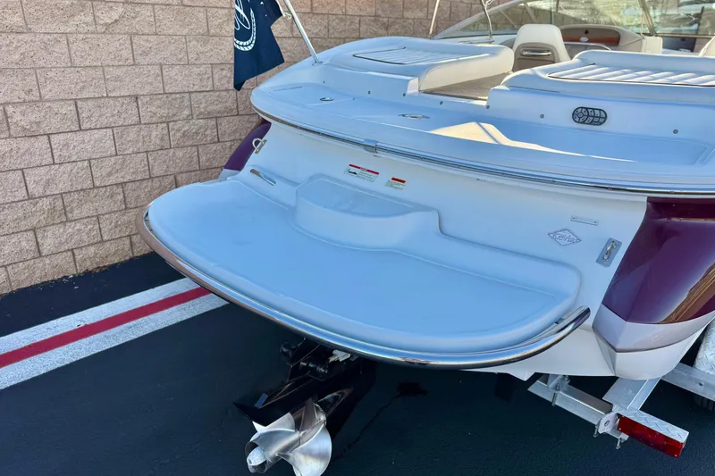Slide: The Image of 2006 Cobalt 220 boat rear view with swim platform and propeller. - 6