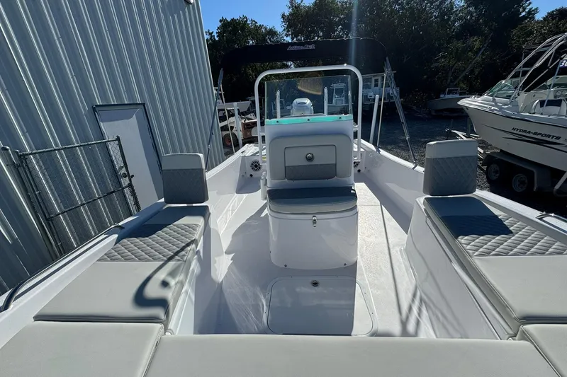 Slide: The Image of 2026 Action Craft 22 Coastal Bay boat with sleek seating and modern design. - 4