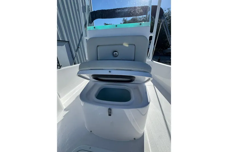 Slide: The Image of 2026 Action Craft 22 Coastal Bay boat interior with open storage compartment. - 6