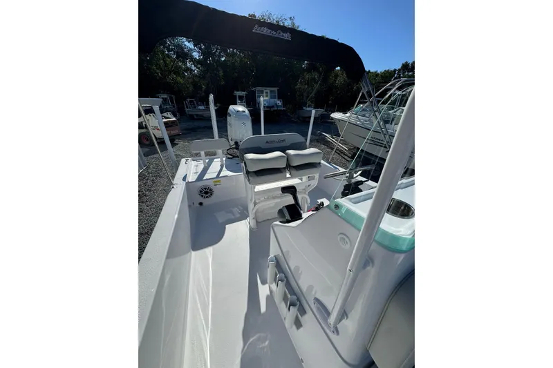 Slide: The Image of 2026 Action Craft 22 Coastal Bay boat interior with seating and console. - 7