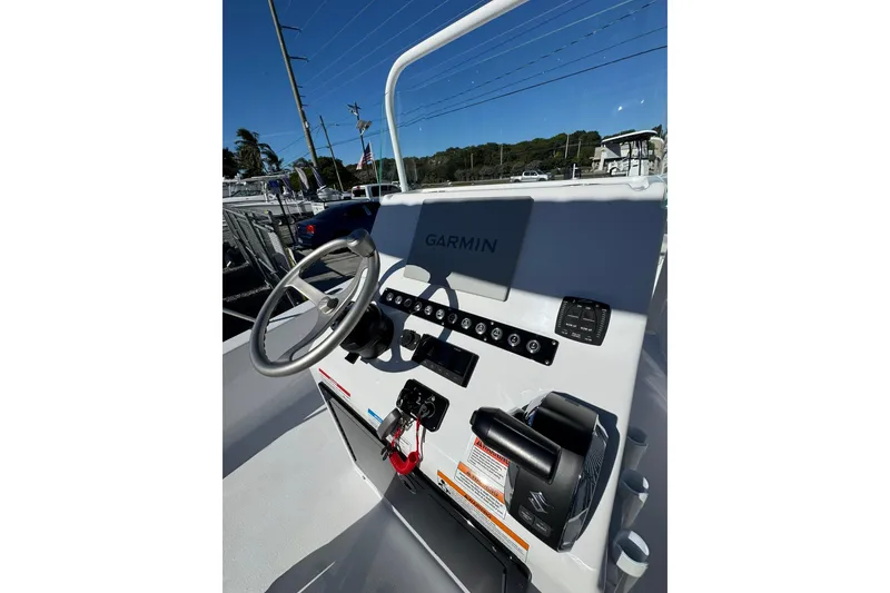 Slide: The Image of 2026 Action Craft 22 Coastal Bay boat console with Garmin navigation system. - 9
