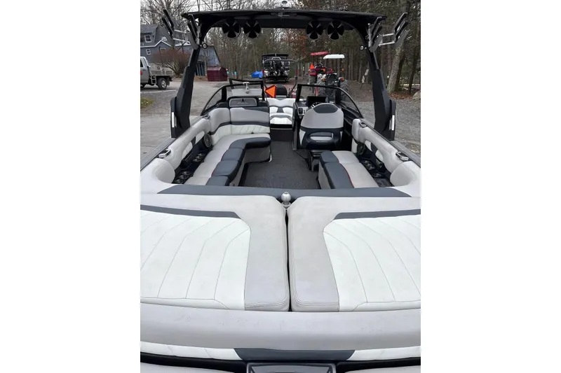 Slide: The Image of 2016 Malibu Wakesetter 25 LSV boat interior with spacious seating and sleek design. - 15