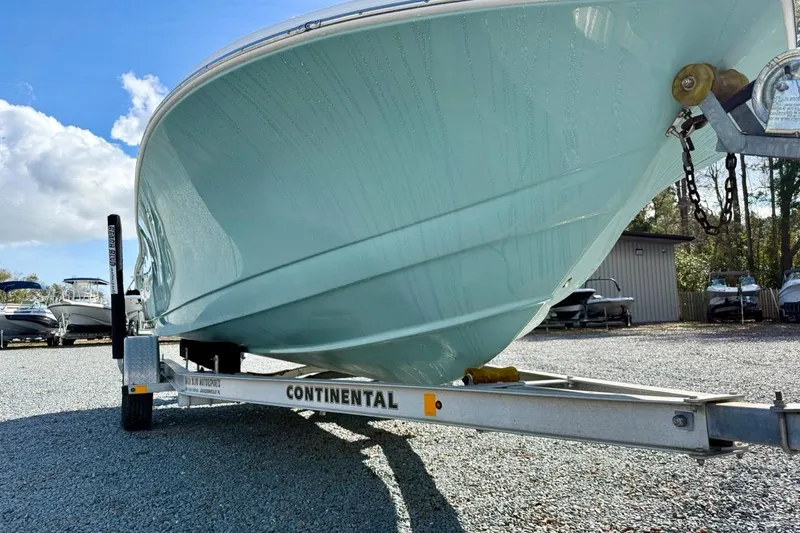 Slide: The Image of 2020 Tidewater 180 CC Adventure boat on Continental trailer, parked outdoors. - 11