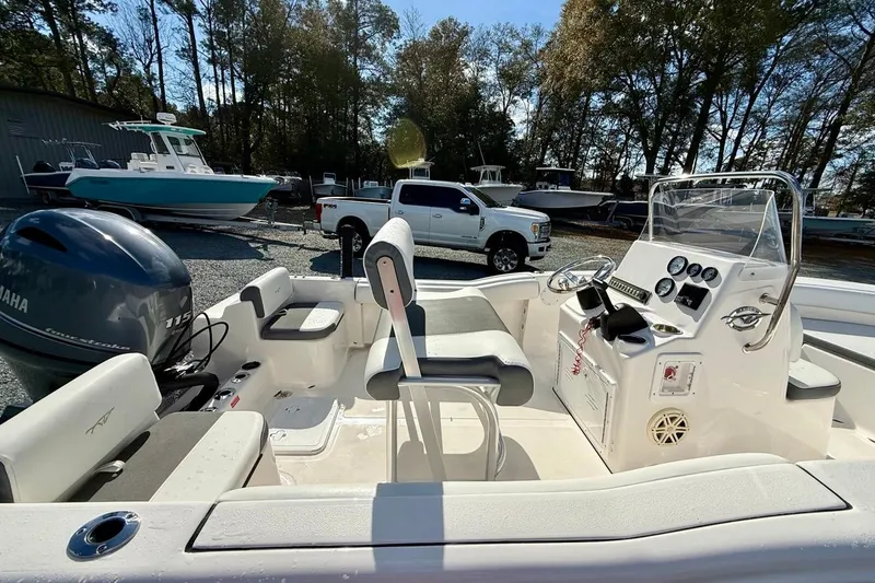 Slide: The Image of 2020 Tidewater 180 CC Adventure boat with Yamaha engine, parked outdoors. - 17