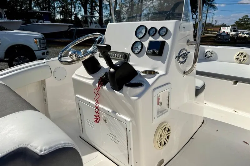 Slide: The Image of 2020 Tidewater 180 CC Adventure boat console with steering wheel and gauges. - 19
