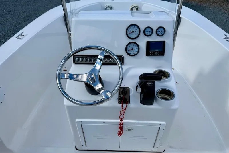 Slide: The Image of 2020 Tidewater 180 CC Adventure boat console with steering wheel and gauges. - 20
