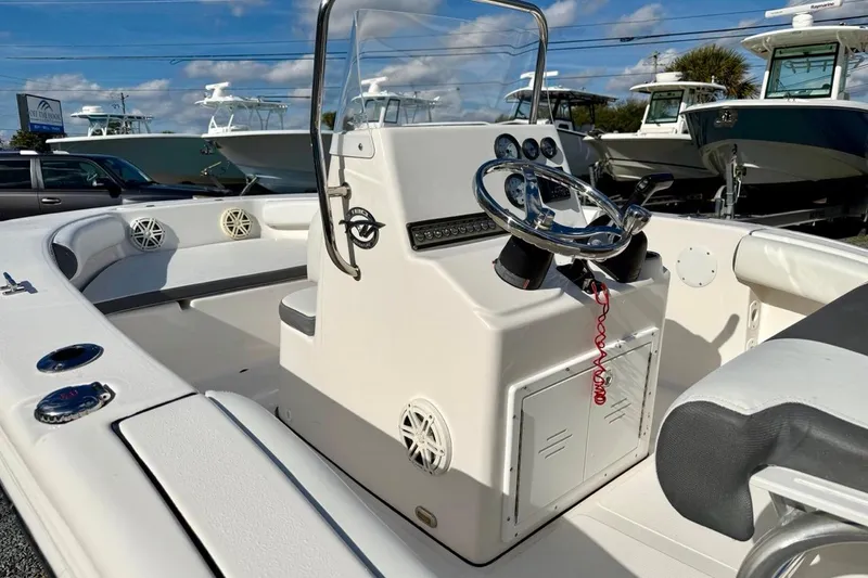 Slide: The Image of 2020 Tidewater 180 CC Adventure boat interior with steering console and seating. - 21