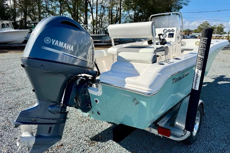 Slide: The Image of 2020 Tidewater 180 CC Adventure boat with Yamaha outboard motor, parked on gravel. - 3