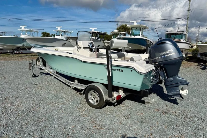 Slide: The Image of 2020 Tidewater 180 CC Adventure boat with Yamaha engine on trailer, parked outdoors. - 6