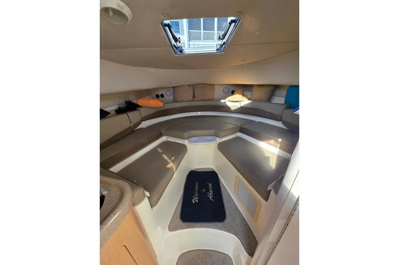 Slide: The Image of Interior cabin of 2001 Boston Whaler 275 Conquest, featuring seating and a skylight. - 15