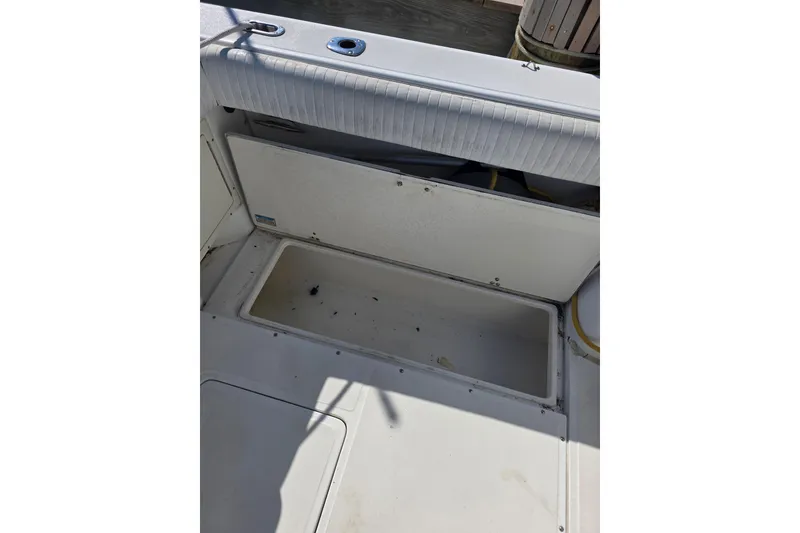 Slide: The Image of 2001 Boston Whaler 275 Conquest boat interior storage compartment. - 24