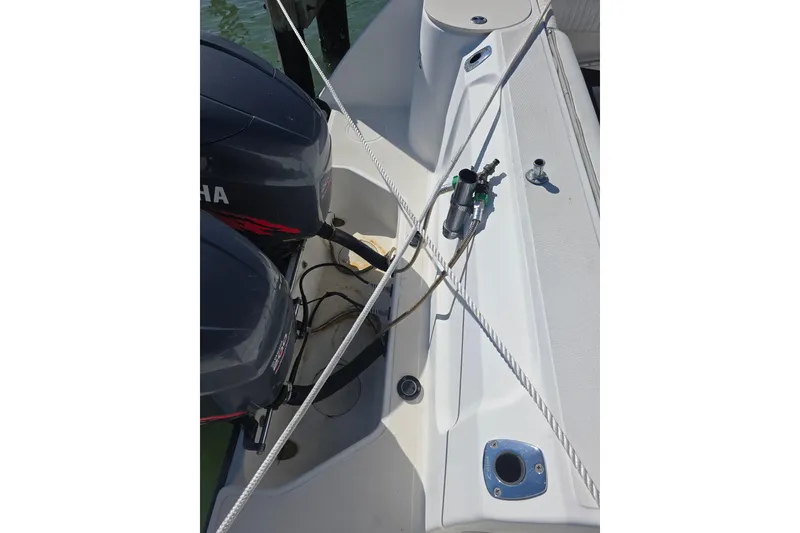 Slide: The Image of 2001 Boston Whaler 275 Conquest boat deck with dual Yamaha engines. - 26