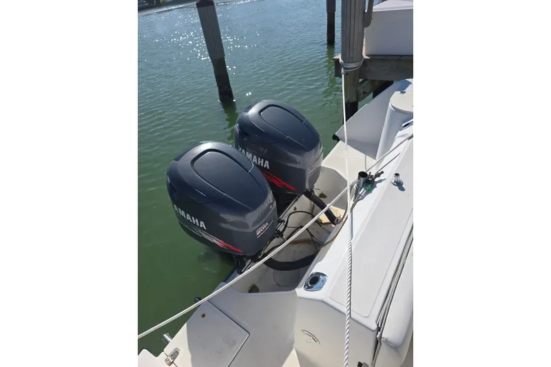 Slide: The Image of Twin Yamaha outboard engines on a 2001 Boston Whaler 275 Conquest boat. - 27