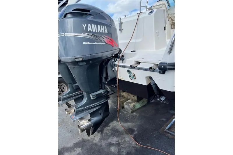 Slide: The Image of 2001 Boston Whaler 275 Conquest docked, aerial view of deck and cabin. - 5
