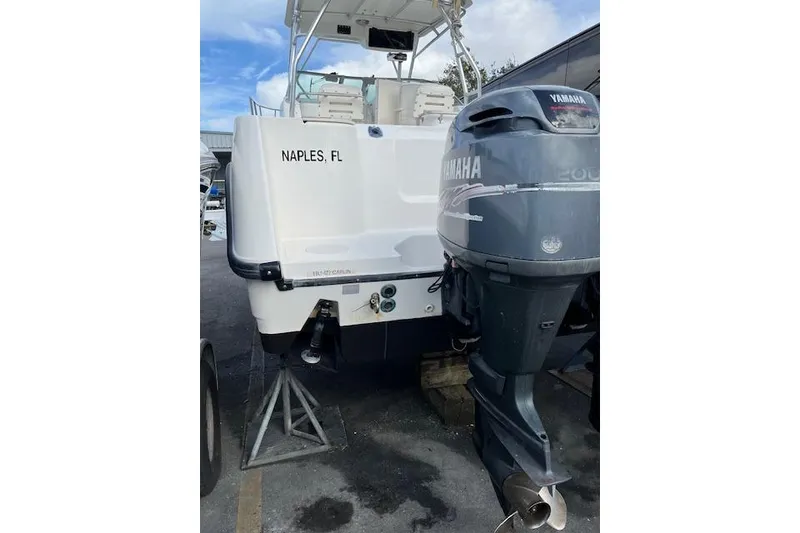 Slide: The Image of 2001 Boston Whaler 275 Conquest boat interior with radio and storage compartment. - 7