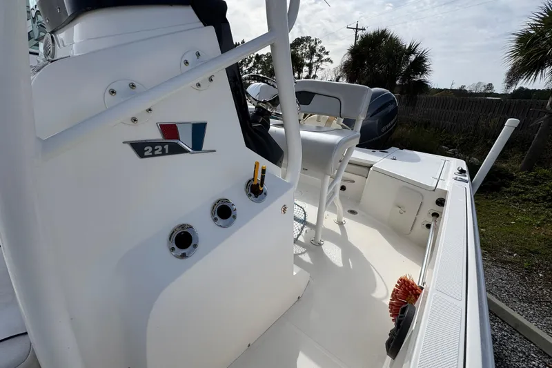Slide: The Image of 2019 Wellcraft 221 Bay boat interior with seating and control panel. - 20