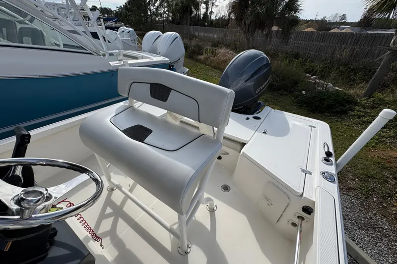 Slide: The Image of 2019 Wellcraft 221 Bay boat interior with steering wheel and seating. - 26