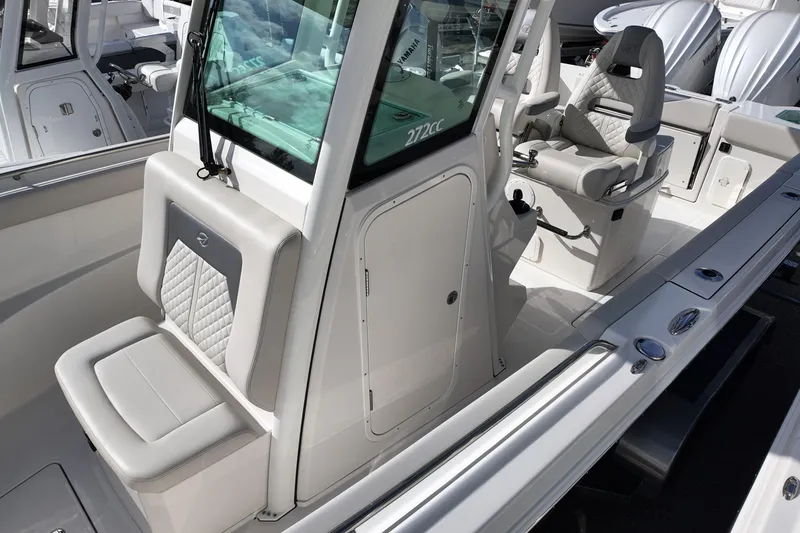 Slide: The Image of 2026 Sailfish 272 CC boat interior with cushioned seating and modern design. - 11
