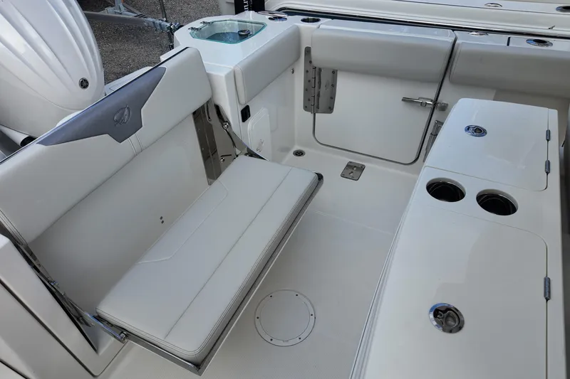 Slide: The Image of 2026 Sailfish 272 CC boat interior with seating and cup holders. - 16