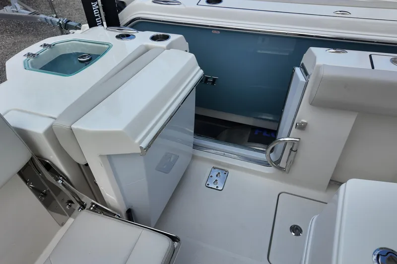 Slide: The Image of 2026 Sailfish 272 CC boat interior with seating and storage compartments. - 17