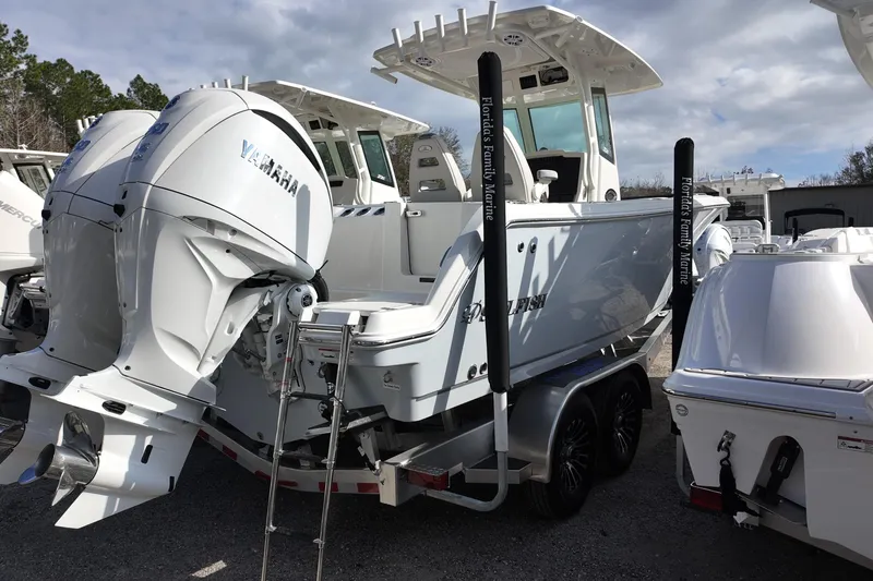 Slide: The Image of 2026 Sailfish 272 CC boat with dual Yamaha engines on a trailer. - 2