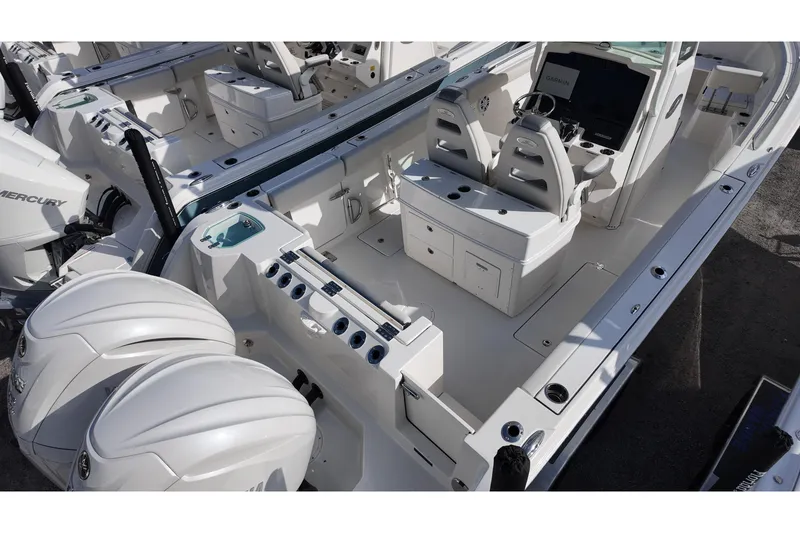 Slide: The Image of 2026 Sailfish 272 CC boat interior with dual Mercury engines, featuring modern seating and controls. - 3