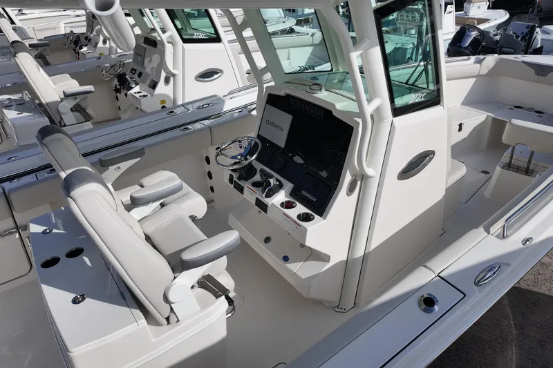 Slide: The Image of 2026 Sailfish 272 CC boat interior with modern helm and seating. - 5