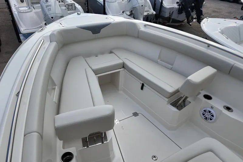 Slide: The Image of 2026 Sailfish 272 CC boat interior with white cushioned seating and modern design. - 8