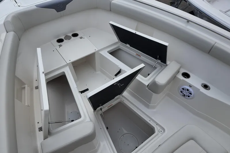 Slide: The Image of 2026 Sailfish 272 CC boat interior with open storage compartments and seating. - 9