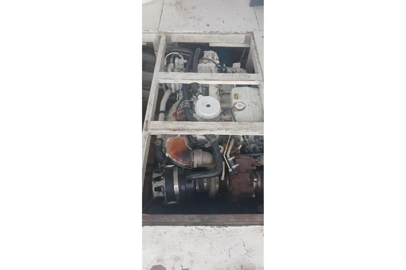 Slide: The Image of Engine compartment of a 1964 Myron Harris 35 Flybridge boat, showing mechanical components. - 3