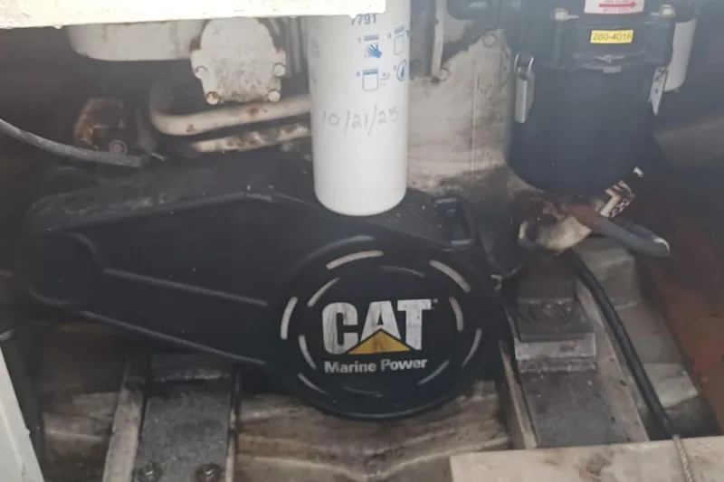 Slide: The Image of Engine compartment of 1964 Myron Harris 35 Flybridge with CAT Marine Power component. - 4