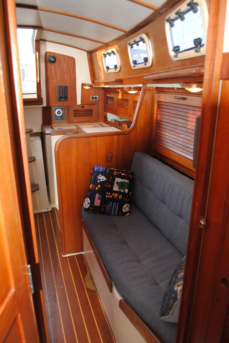 Slide: The Image of Interior of a 1988 Tartan 28 yacht with wooden finish. - 23