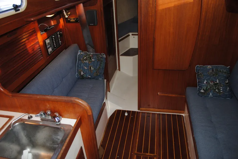 Slide: The Image of Interior of a 1988 Tartan 28 yacht with wooden finish. - 28