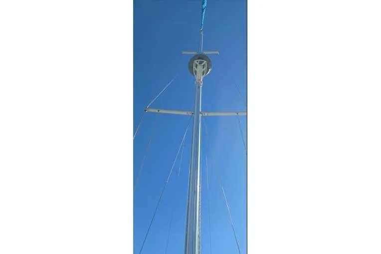 Slide: The Image of Mast of a 1988 Tartan 28 sailboat against blue sky. - 37