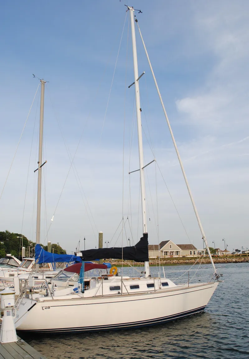 Slide: The Image of 1988 Tartan 28 sailboat docked at marina. - 8