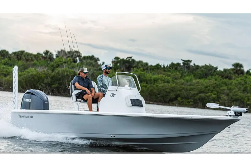 Slide: The Image of Manufacturer Provided Image: 2026 Tidewater 2110 Bay Max boat cruising on water with two passengers. - 1
