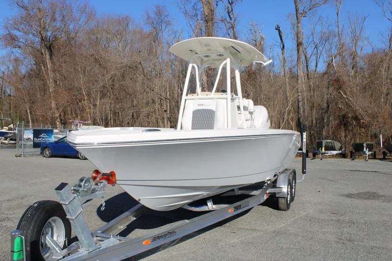 The Image of 2026 Pathfinder 2400 Open boat on trailer in outdoor setting. - 0