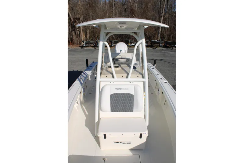 Slide: The Image of 2026 Pathfinder 2400 Open boat, center console view, parked outdoors. - 9