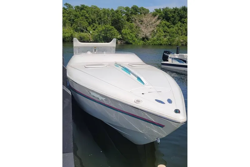 Slide: The Image of 1999 Baja 29 Outlaw boat stern with dual propellers and MercCruiser outdrives. - 5