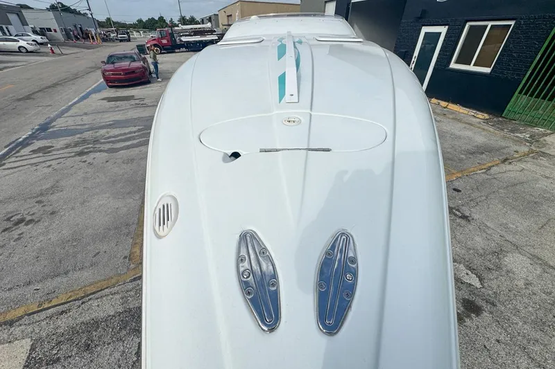 Slide: The Image of 1999 Baja 29 Outlaw boat on urban street, top view. - 57